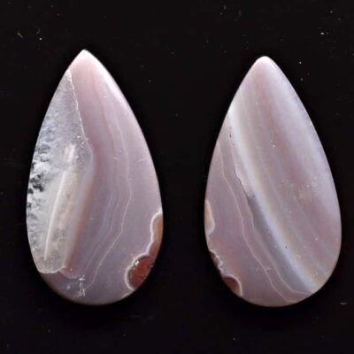 A pair of pink and white agate tear shaped cabochons.
